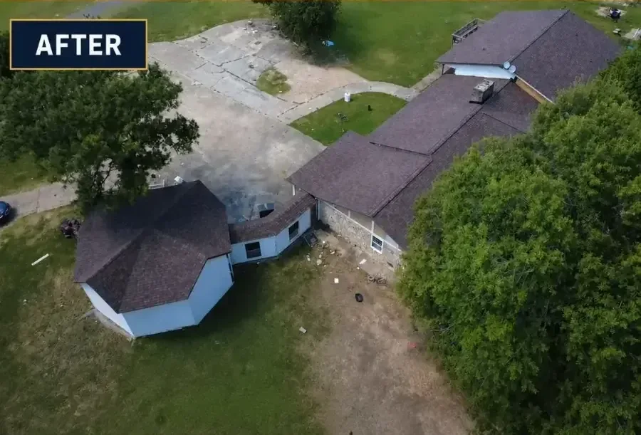The same home from above once finished: new architectural shingles on every slope, clean ridge lines, and the yard cleared.